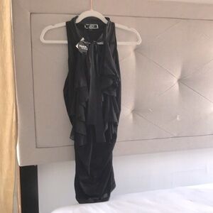 Unique sleeveless Fumblin’ Foe ruffle blouse.